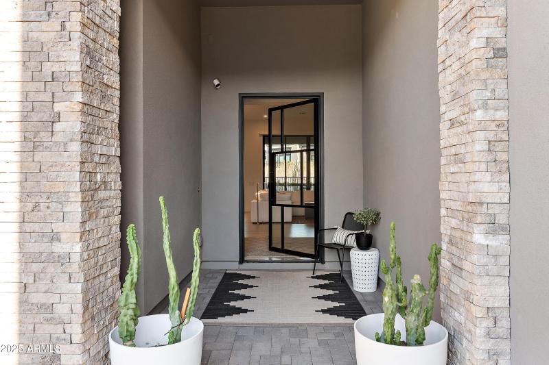 Entrance w/ glass & steel front door