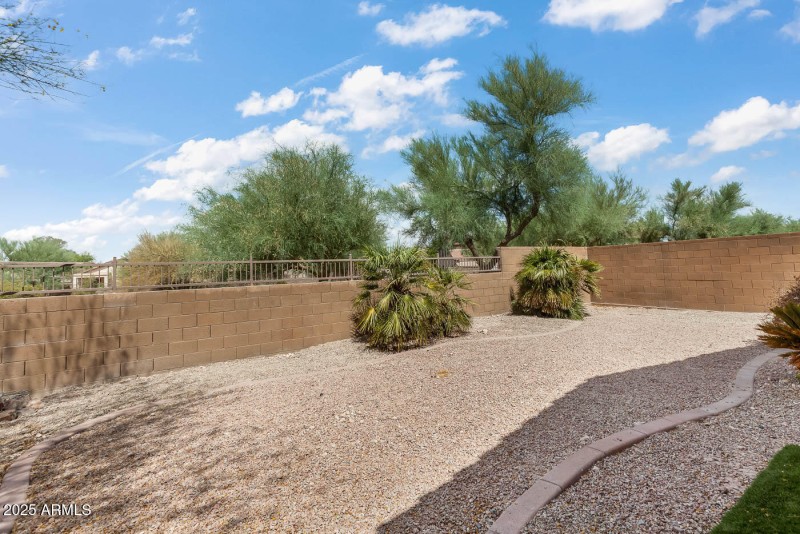 Backyard and wrought iron block fence