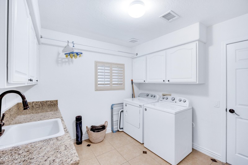 Huge Laundry w sink and storage