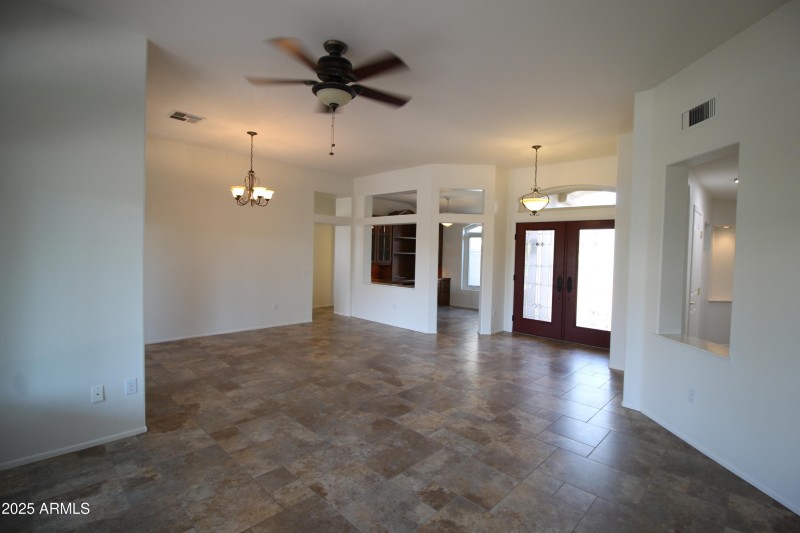 LR TOWARD FOYER AND DEN