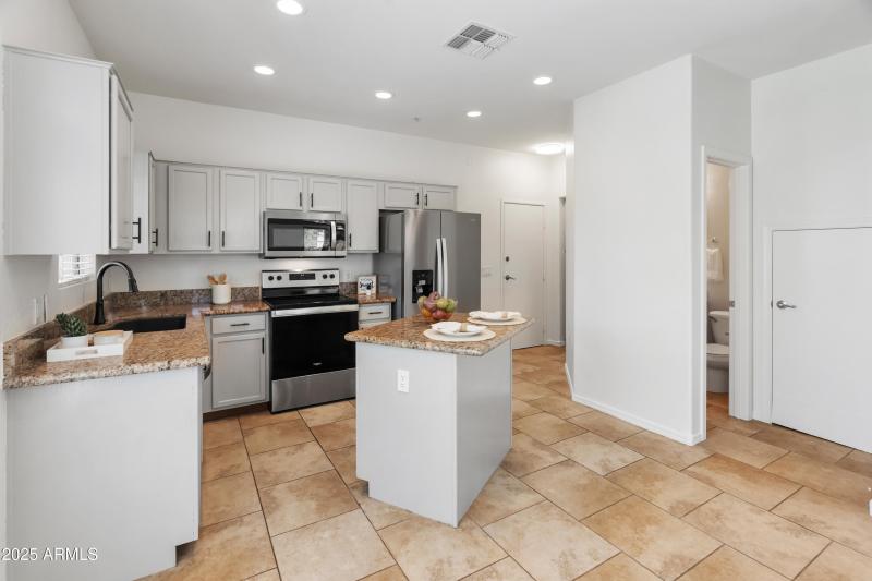 Kitchen to Garage & Powder Room