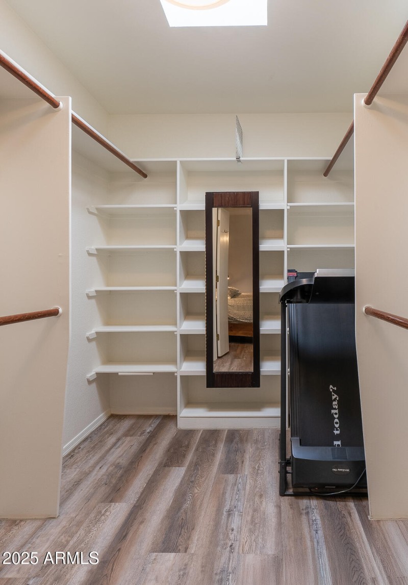 PRIMARY SUITE; WALK IN CLOSET WITH STORA