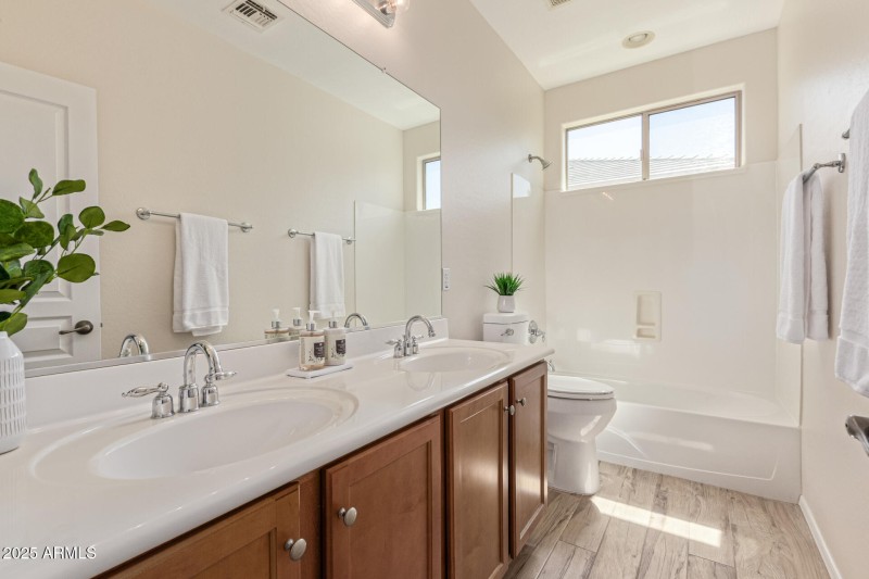 Hall bathroom with dual vanity