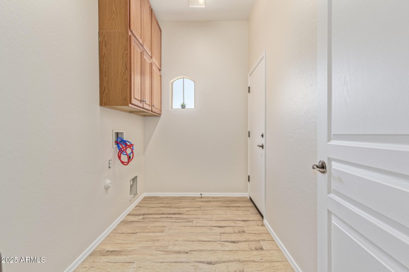 Laundry room with cabinet storage