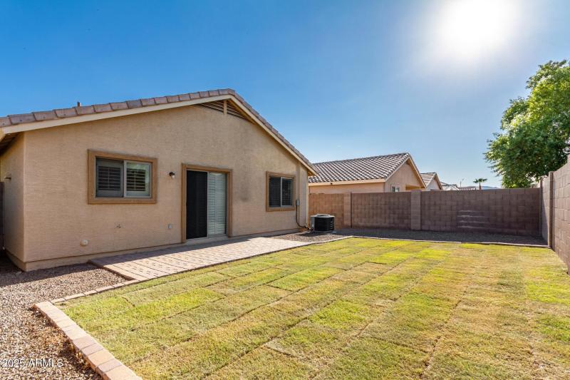 Spacious Backyard with Grass