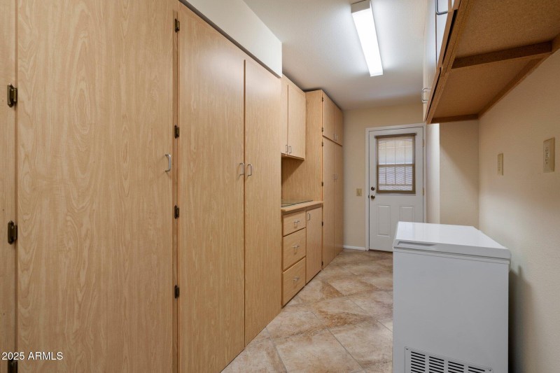 Built in storage at laundry room