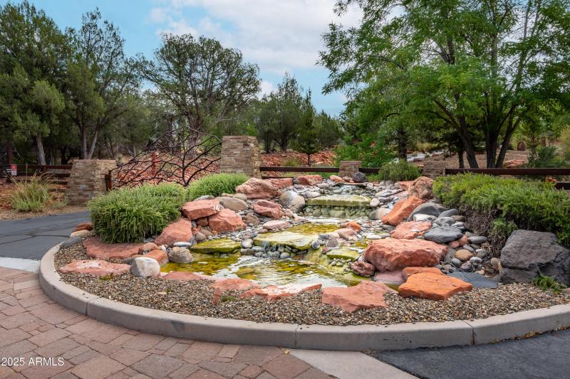 Gated entrance w fountain