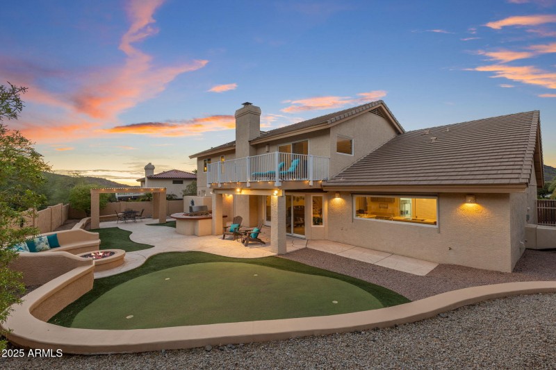 Rear of home and backyard