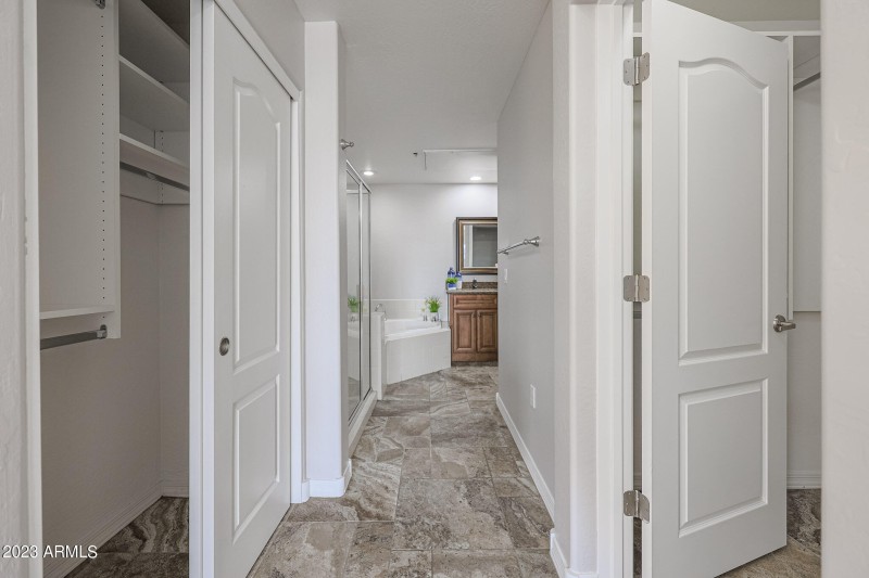 two closets for primary bedroom