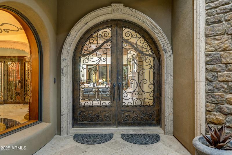 Grand Iron & Stone Entry Doors