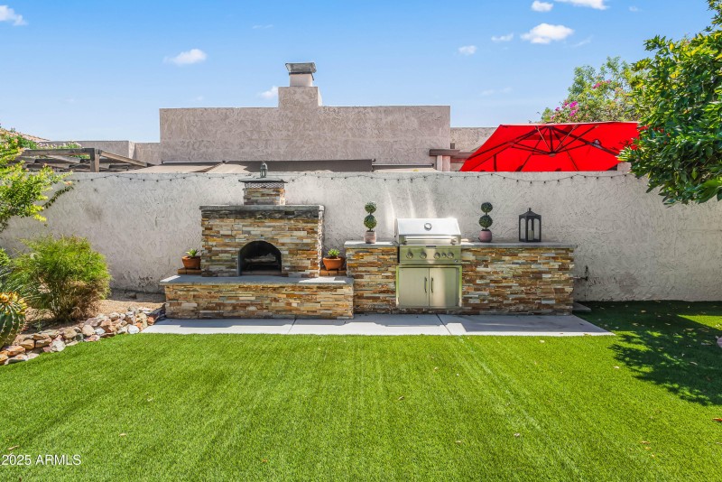 Rear of Home with Fireplace and BBQ