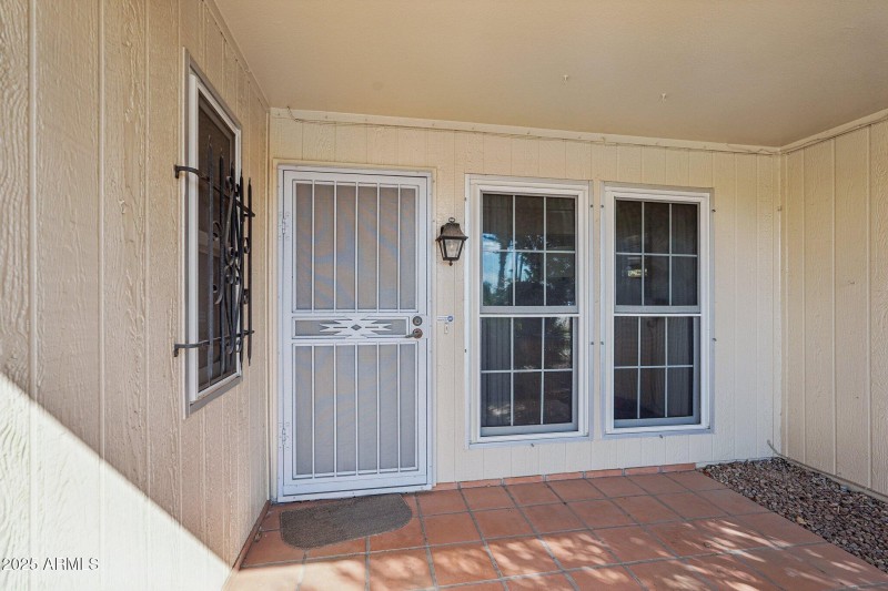 tiled / covered front entry