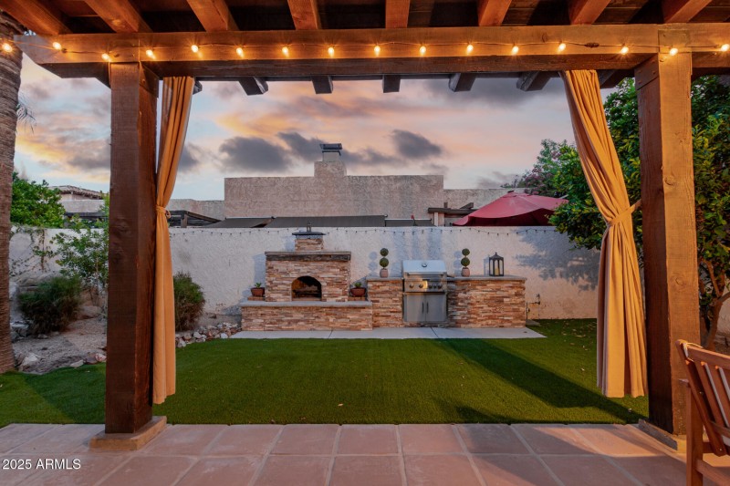 Rear of Home with Fireplace and BBQ