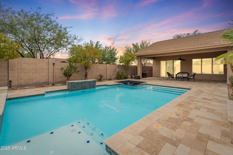 Back of home with pool