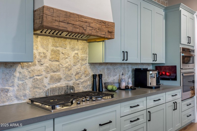 Limestone backsplash and imported beam