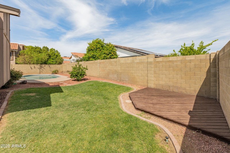 Backyard Grass Area with Sunset Patio