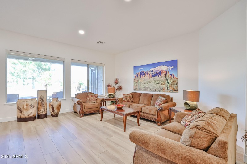 Large bay windows look out to rear patio