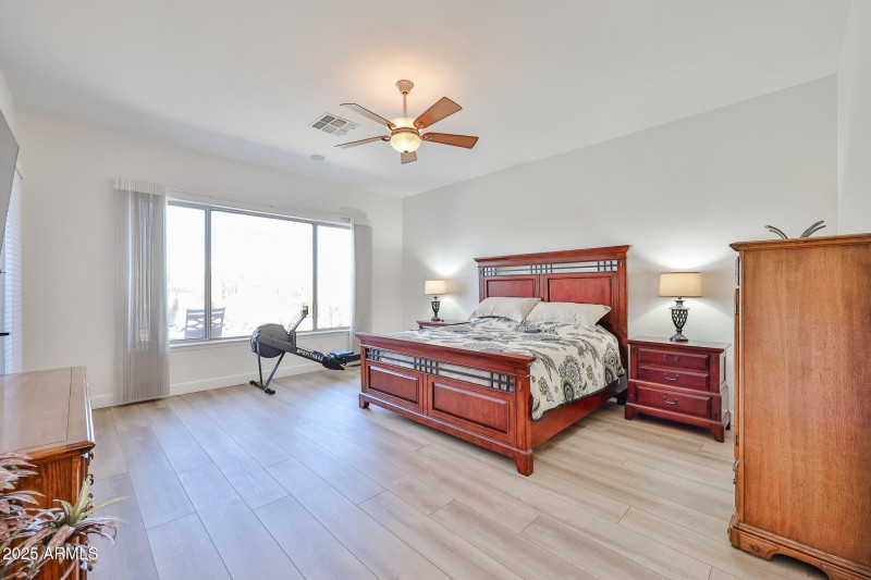 Primary bedroom with view of golf course