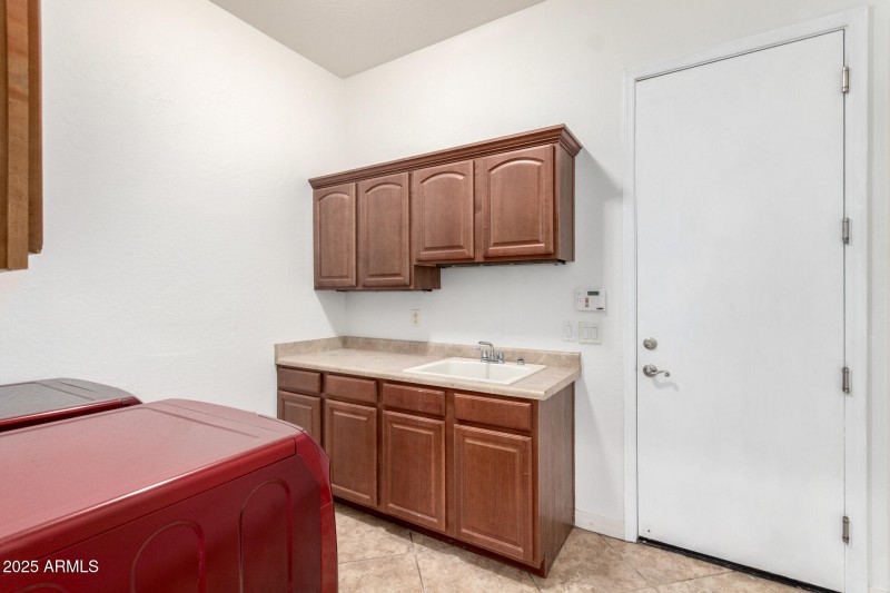 Laundry room with utility sink