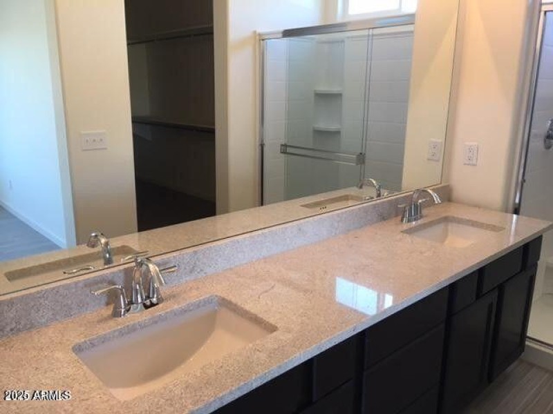 Primary bathroom with double sinks.