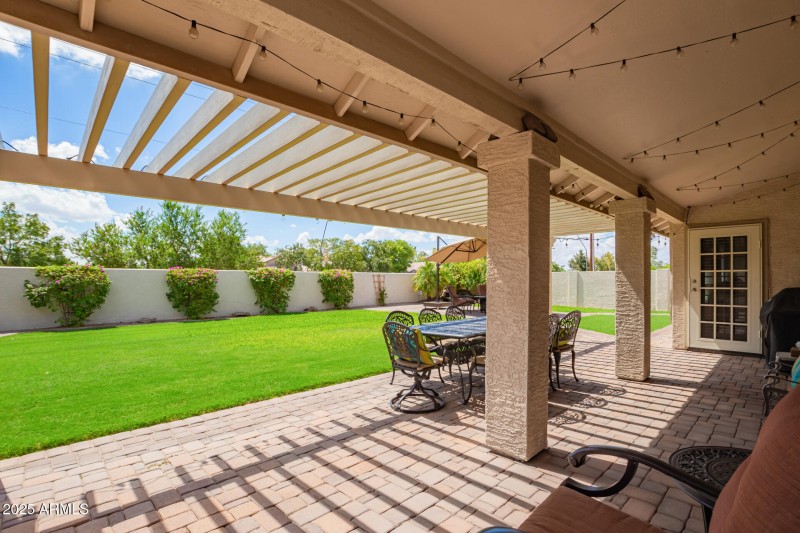 Backyard extended patio with pergola