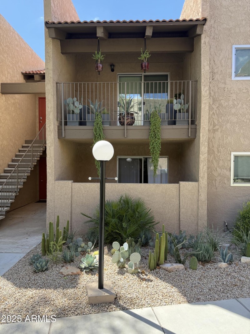 Front of home, upstairs balcony