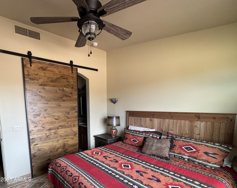 Apartment bedroom barn door to bath