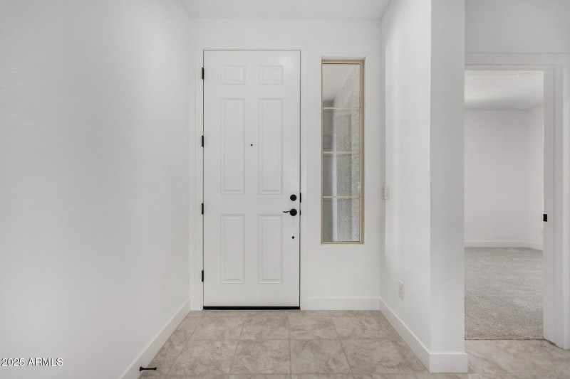 Front entrance with view of bedroom