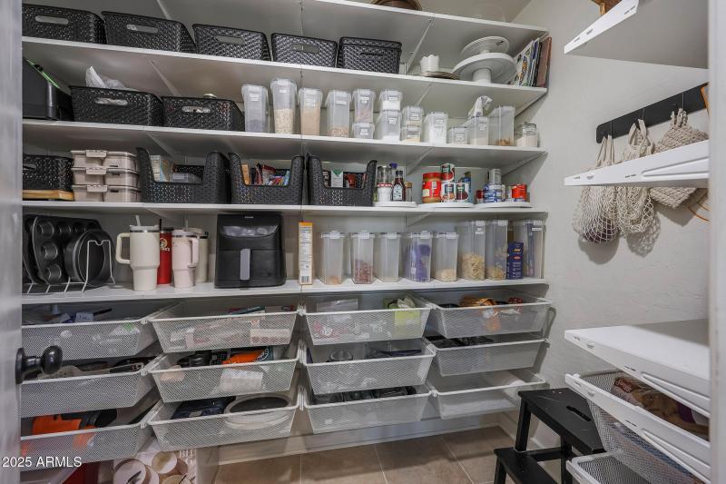 Pantry with custom shelves and bins