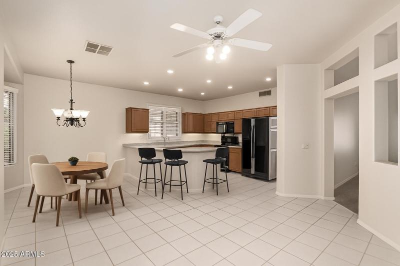 Virtually staged eat in kitchen