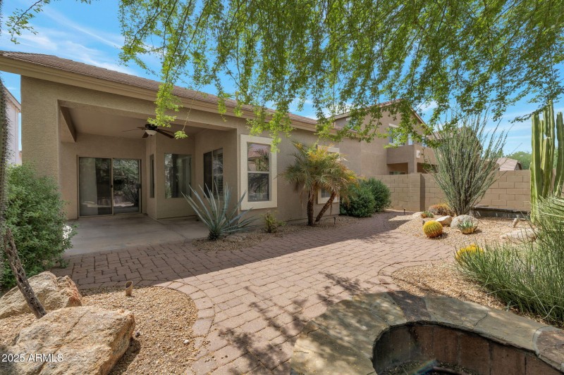 backyard with pavers and firepit