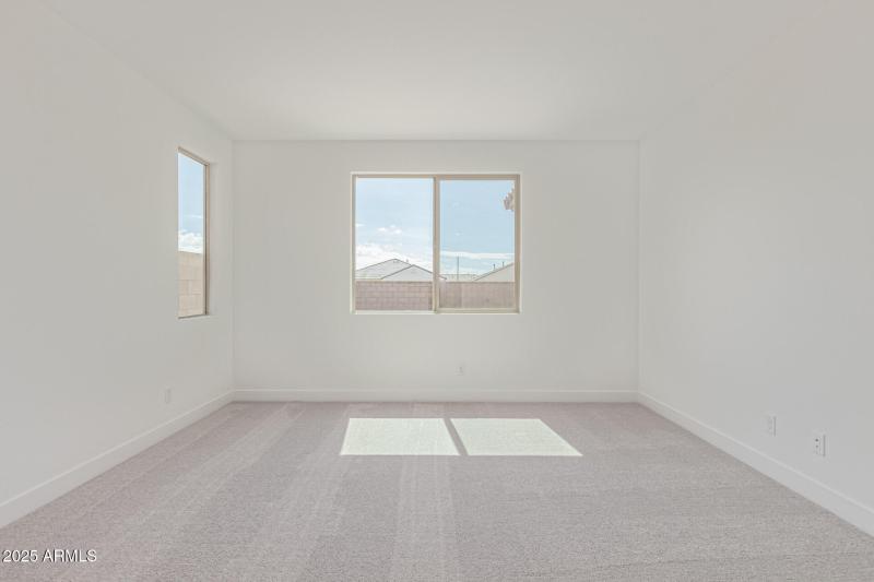 Primary Bedroom and view of Backyard