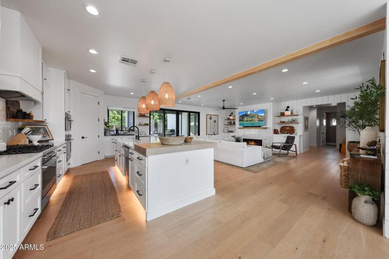 Light oak flooring, open concept living