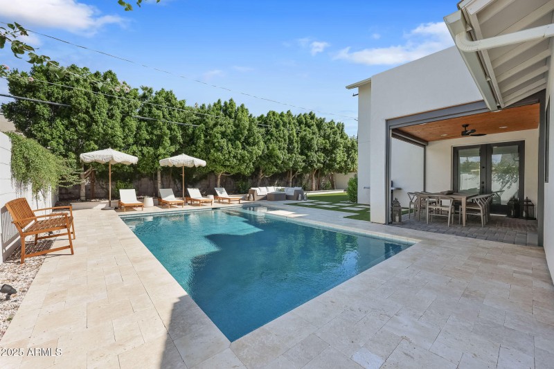 Heated pool w/ travertine tile