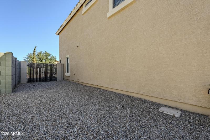 View of double gate from front side yard
