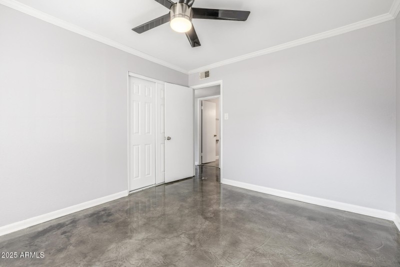 Bedroom 2 with closet and view of hallwa