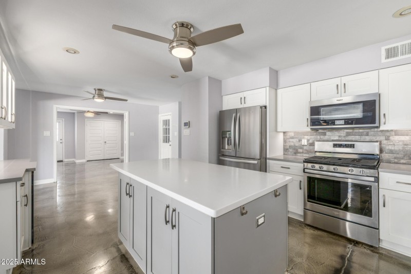 Kitchen with view of Den:office with ac