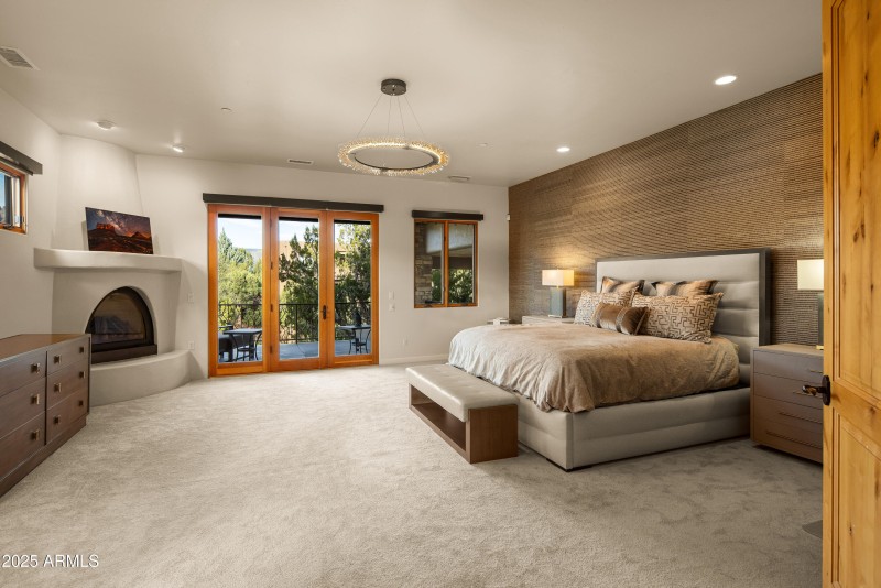 PRIMARY BEDROOM OFFERS PRIVATE PATIO