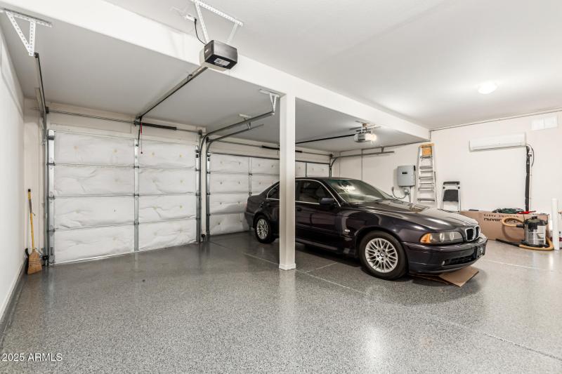 Cooled 3 car garage w/epoxied floor