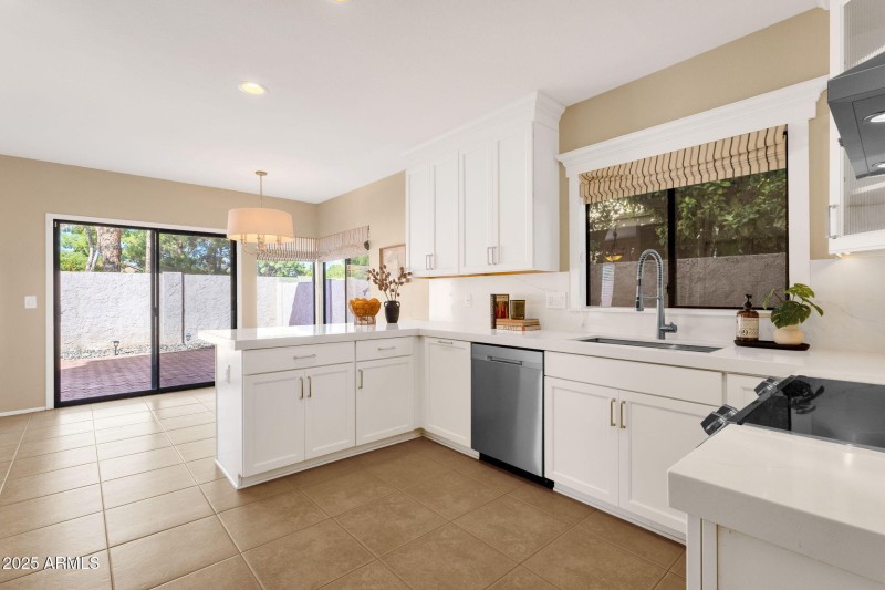 White cabinetry and quartz countertops