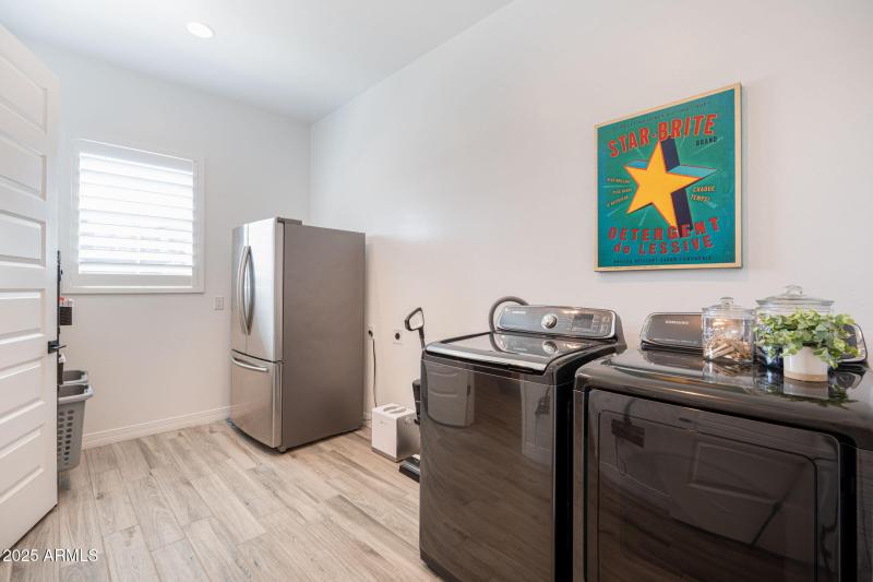 utility room w/access to primary closet