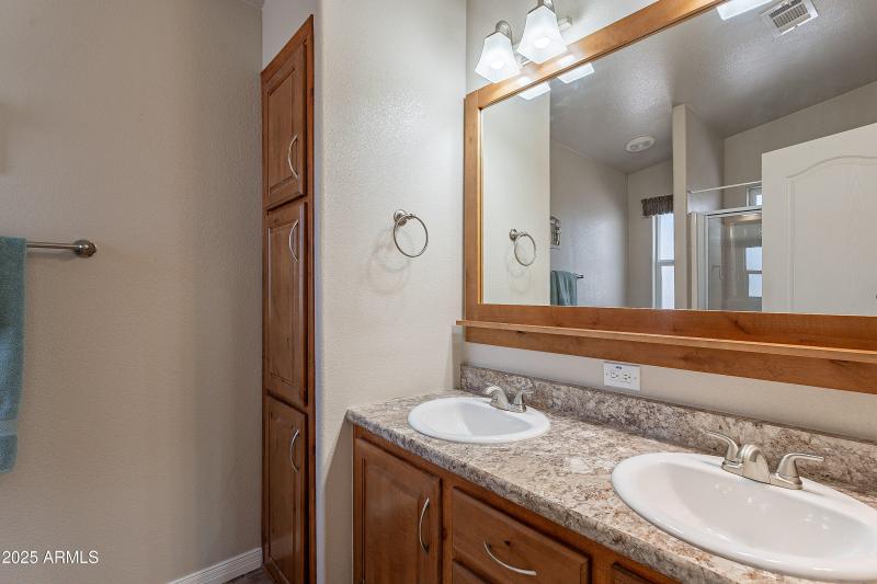 Raised, dual vanitys in main bath