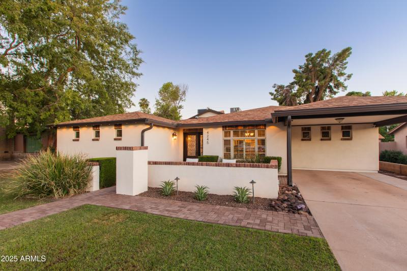Carport in Front + 2 Car Garage In Back