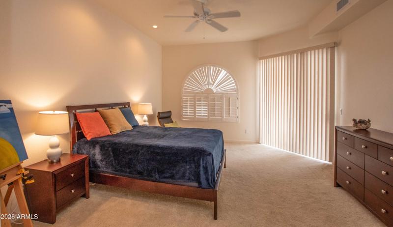 DOWNSTAIRS MASTER w/ SLIDERS TO PATIO