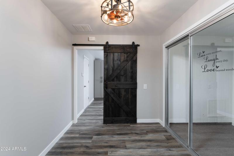 Modern Hallway with Barn Door Accent