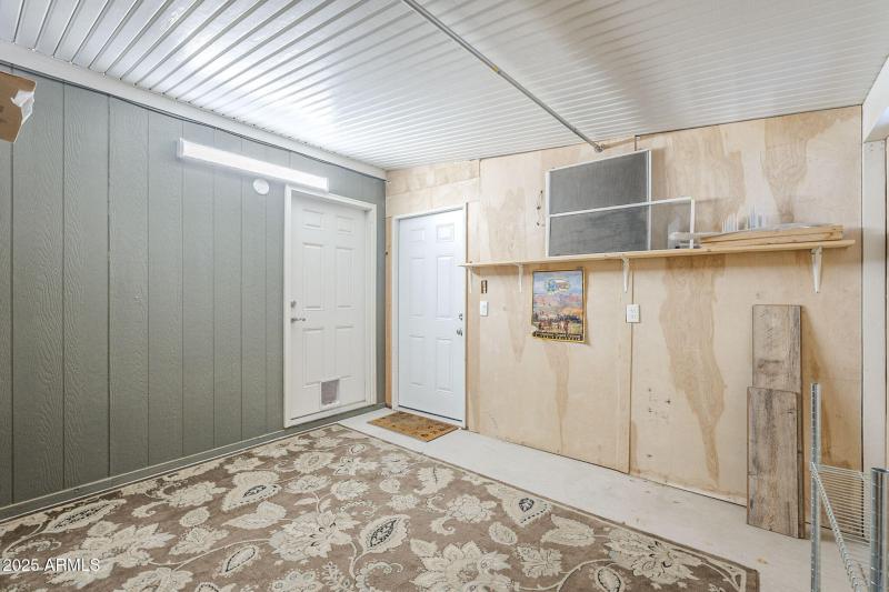 Shed with carport & house access