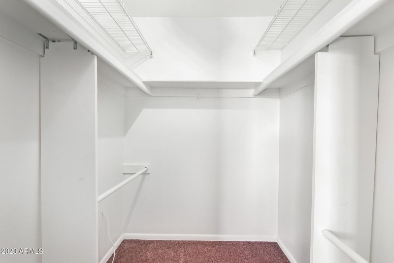 Primary bedroom walk in closet