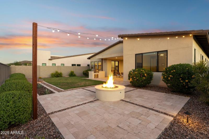 Travertine-lined patio and gas firepit