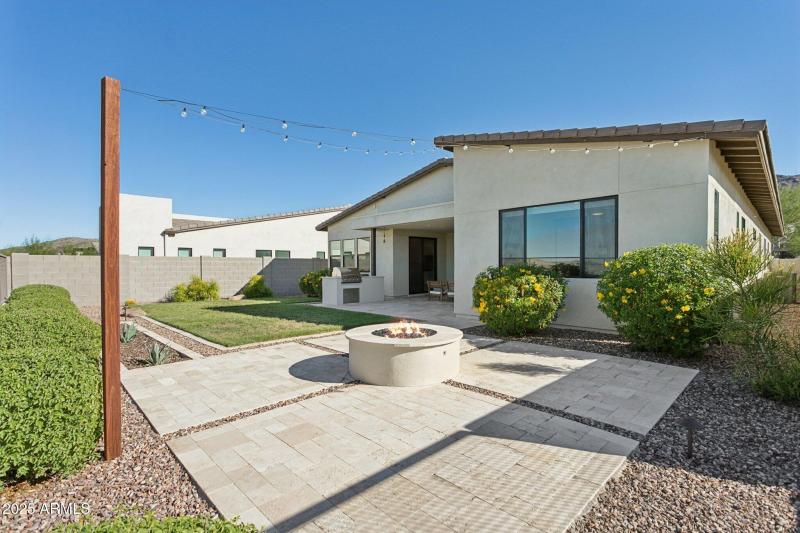 Bistro lights strung above firepit