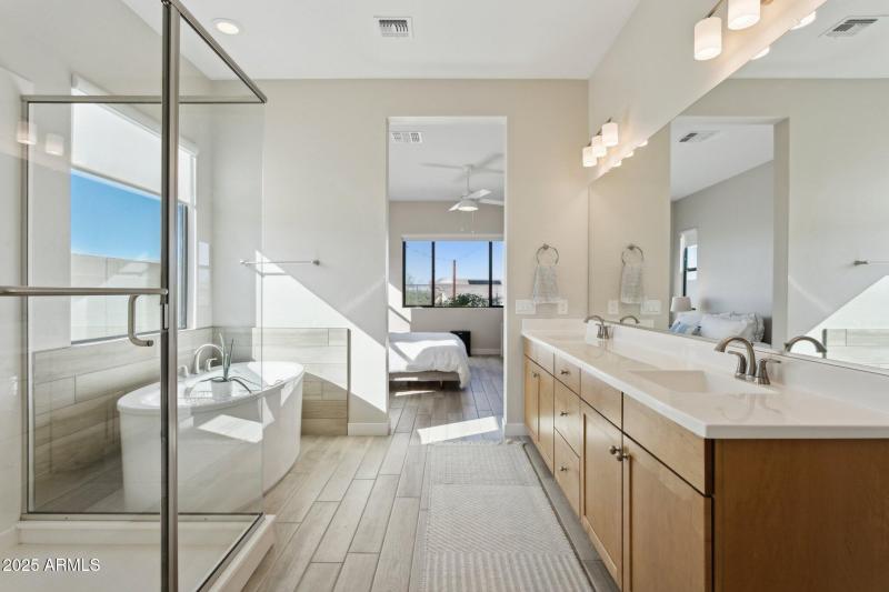 Primary soaking tub and expanded shower